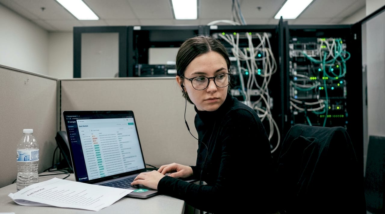 IT analyst auditing network logs for compliance