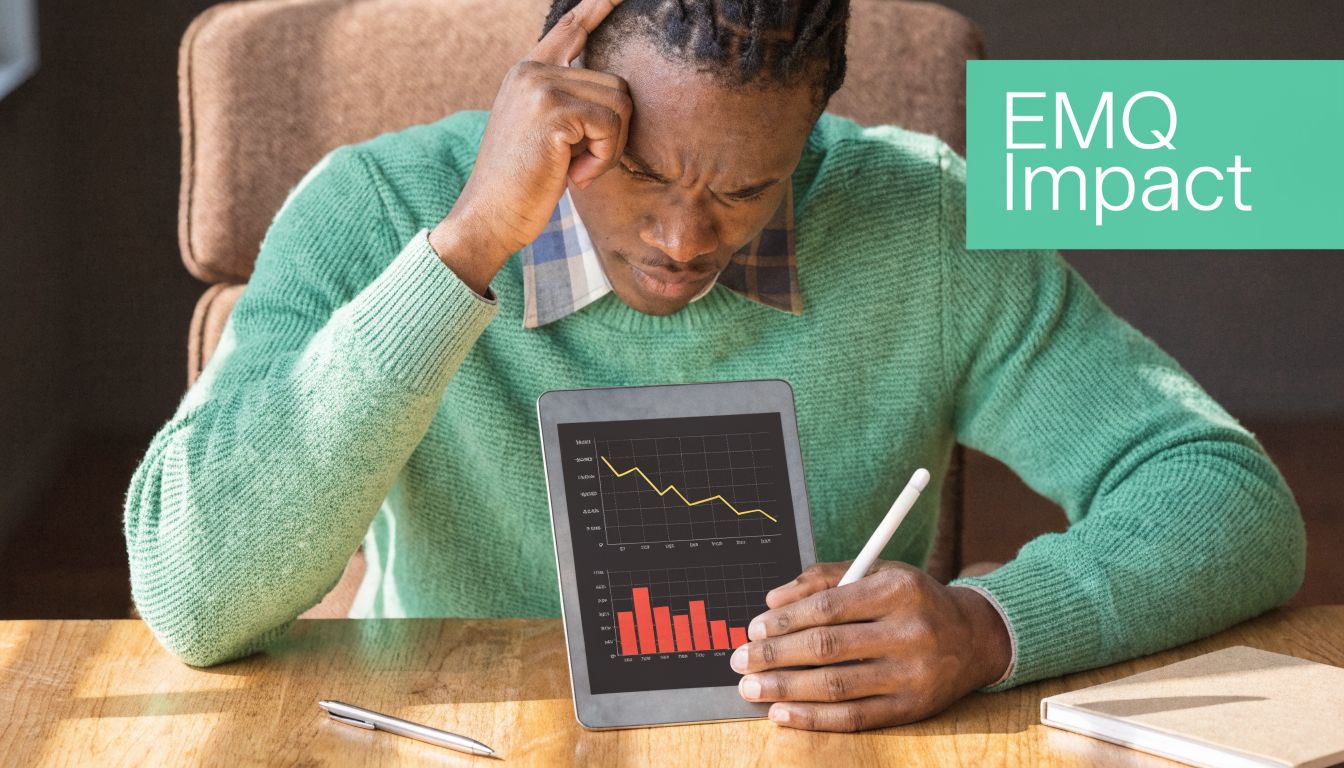 A man in a green sweater looks stressed while reviewing declining financial charts on a tablet.