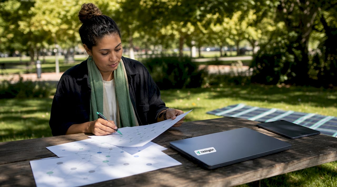Marketing analyst reviewing printed data validation rules at desk