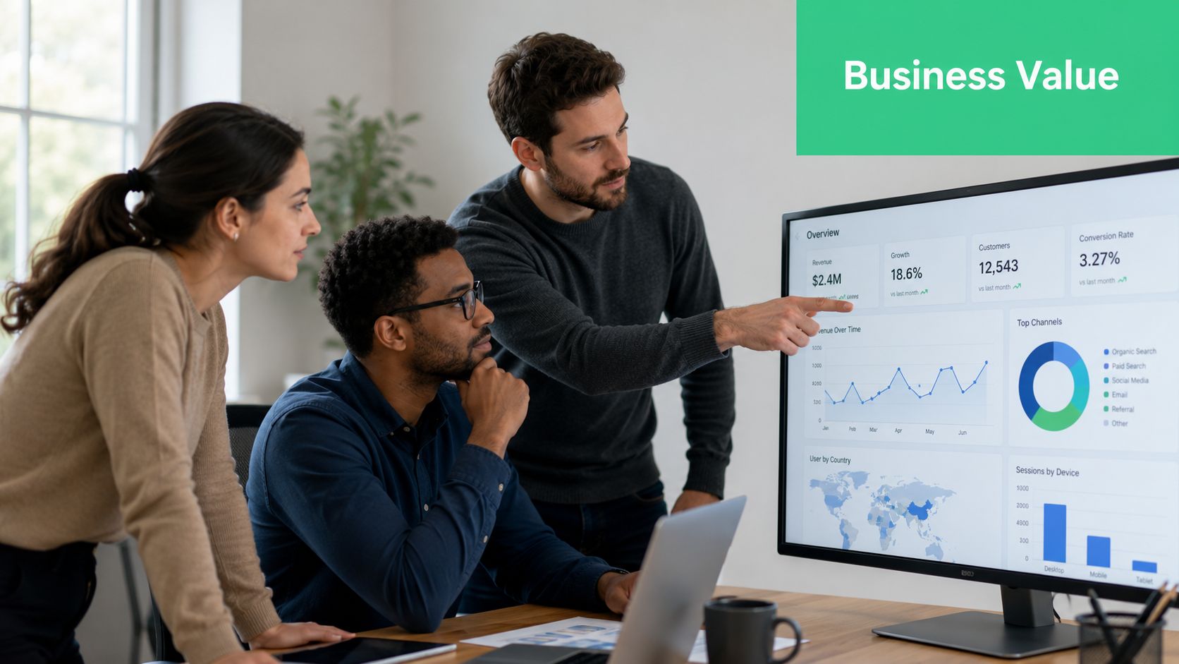 A diverse team of business professionals collaboratively analyzing performance data on a large office computer monitor.