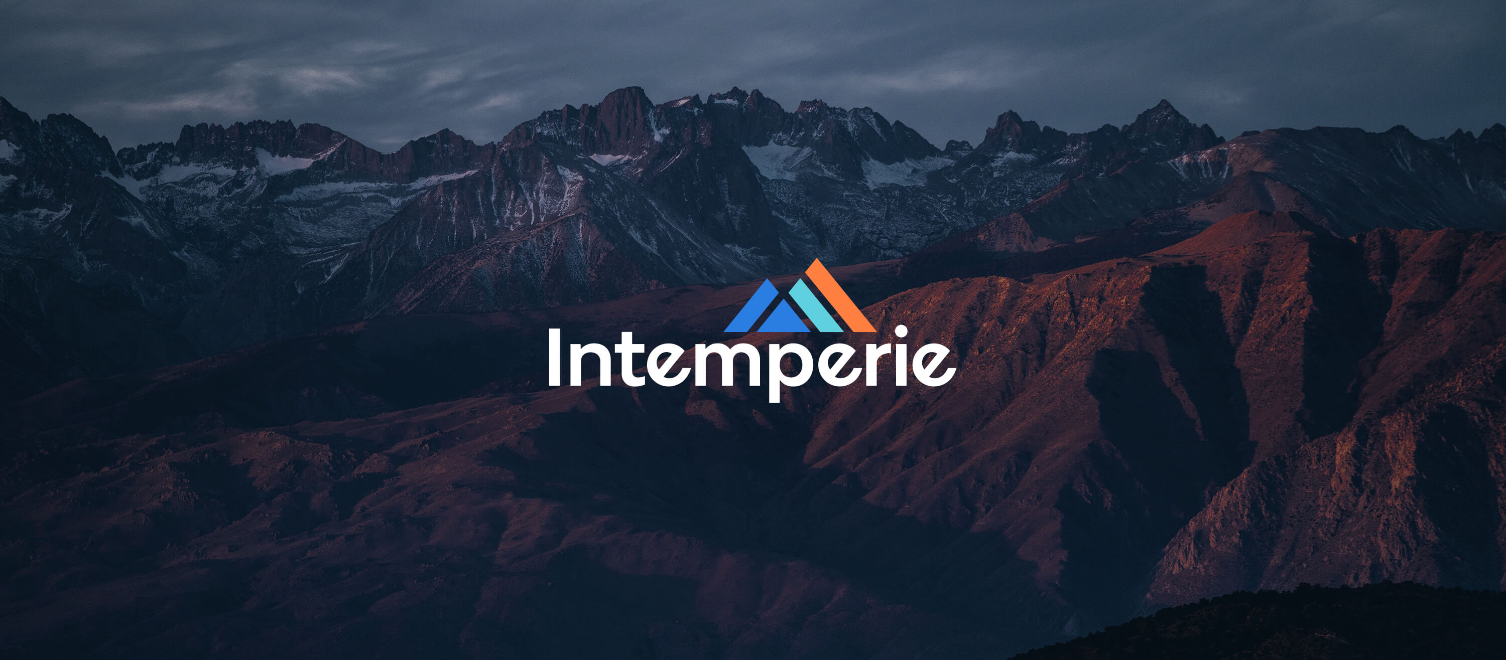 intemperie logo over a beautiful landscape of an american national park