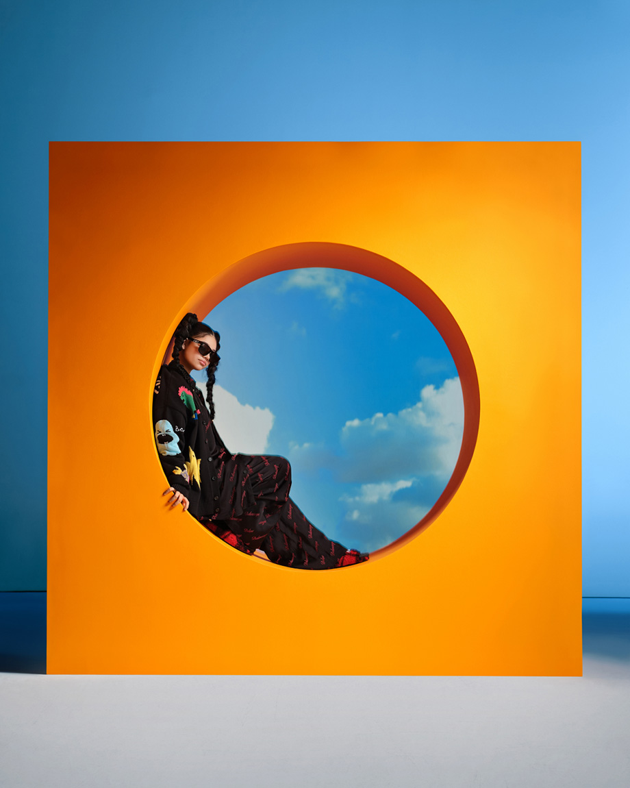 Person sitting in orange circle