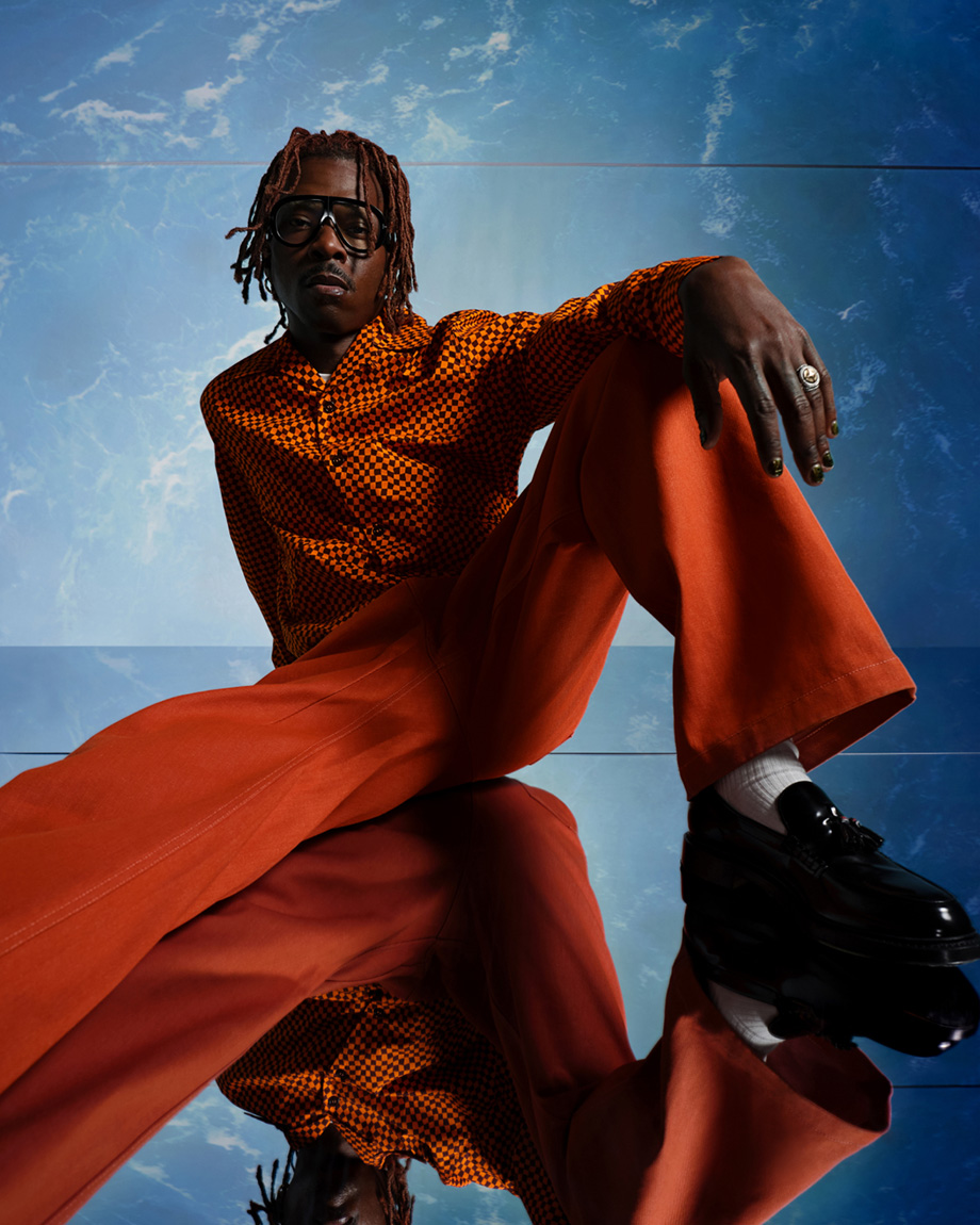 Man wearing orange sitting