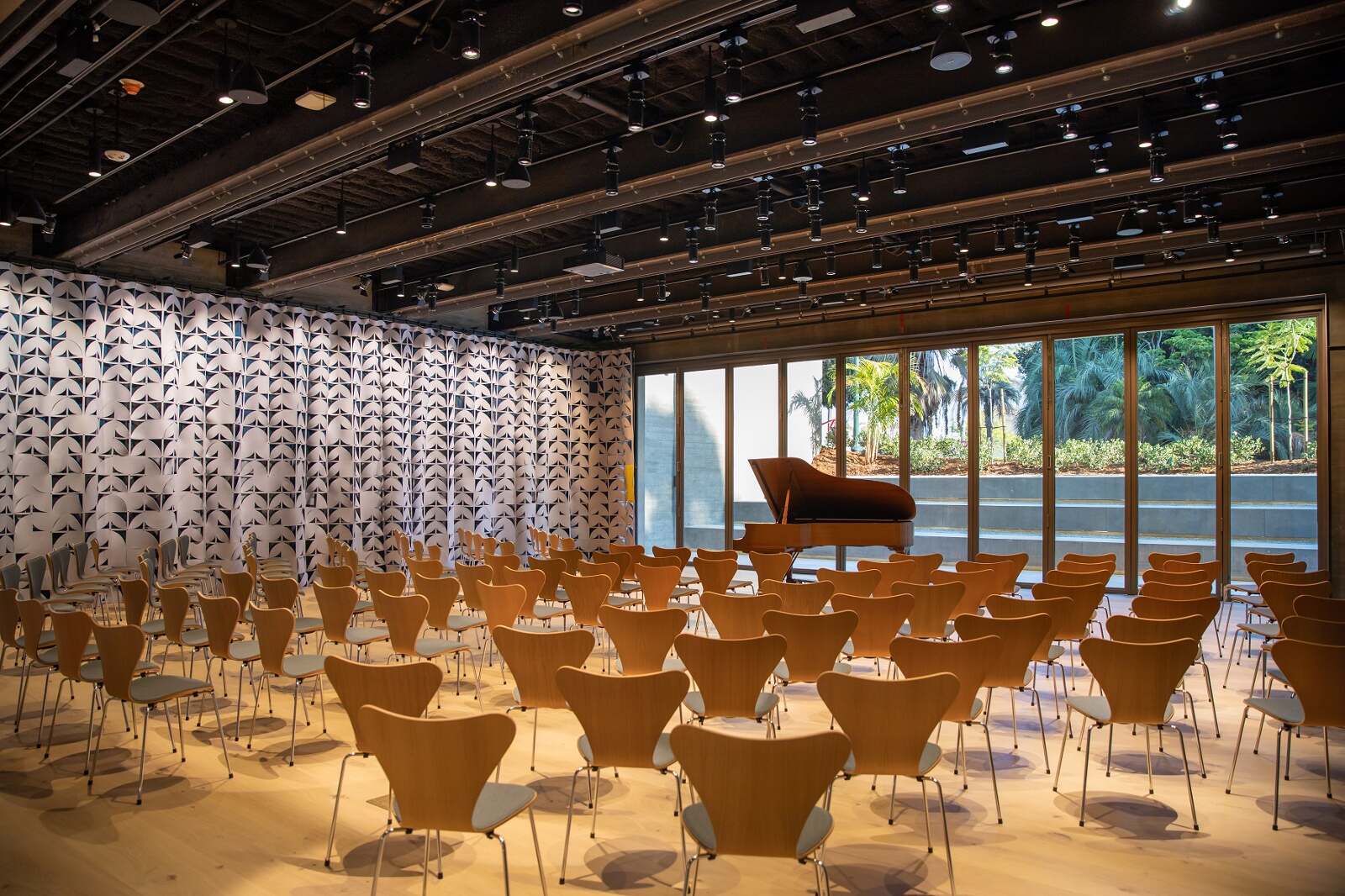 An interior shot of the Mingei Museum auditorium with chairs and the Sessions Curtain