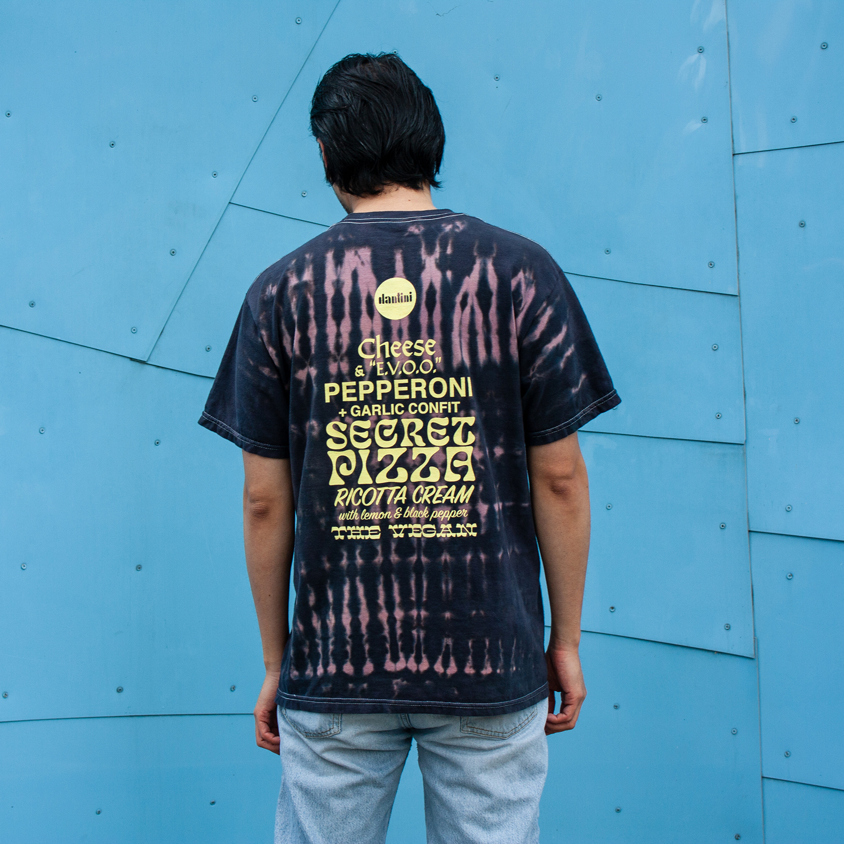 A man wearing a Dantini tie dye T-shirt