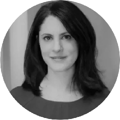 Black and white headshot of a woman with shoulder-length dark hair and a slight smile.
