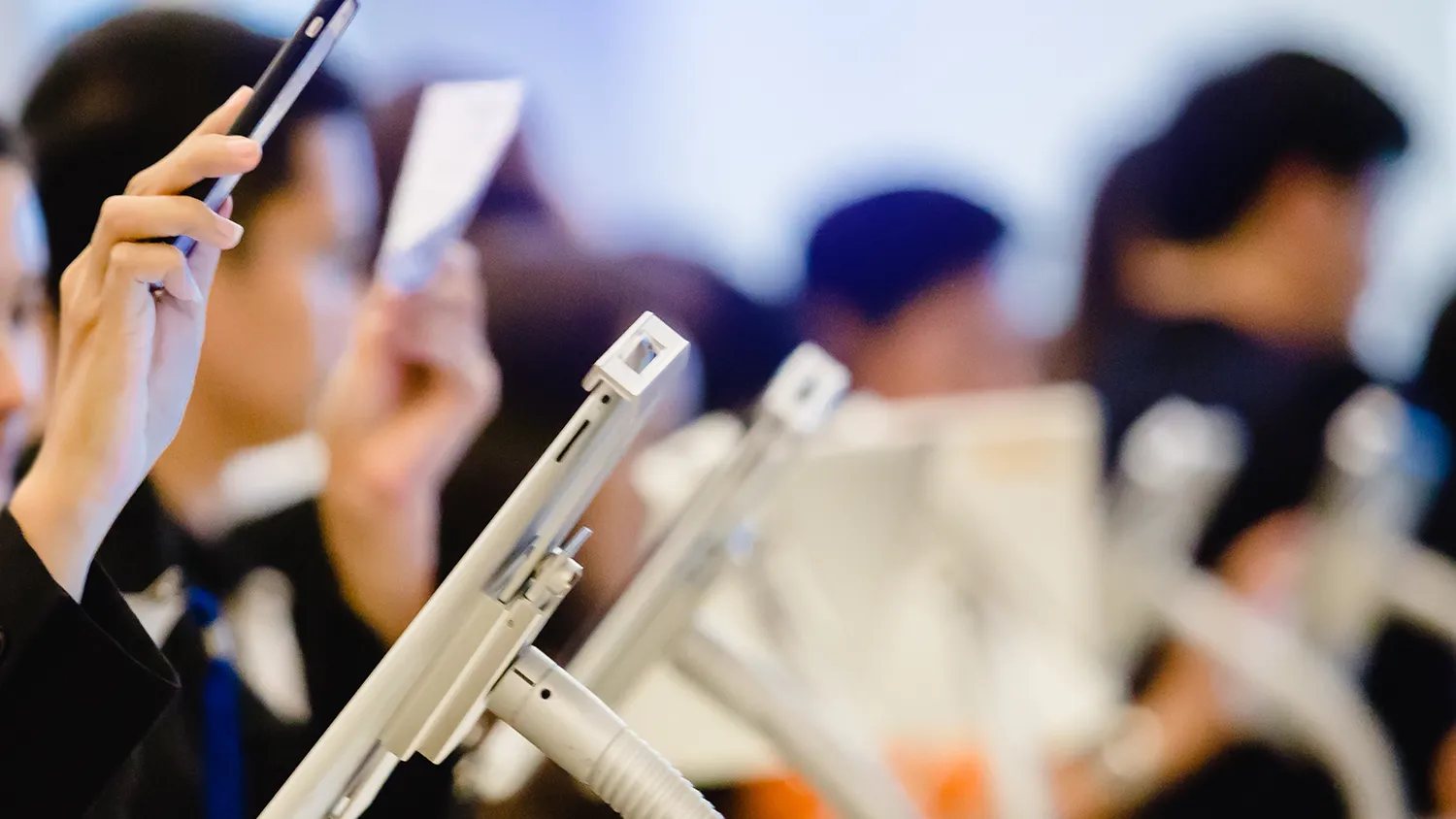 Attendees using self-serve kiosks for event check in with on-demand badge printing