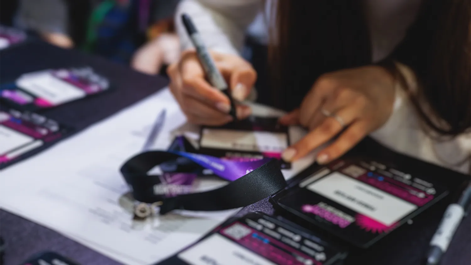 Screenshot of an event platform creating ticket types with attendee-type pricing, discount codes, and conditional form questions in a single workflow.