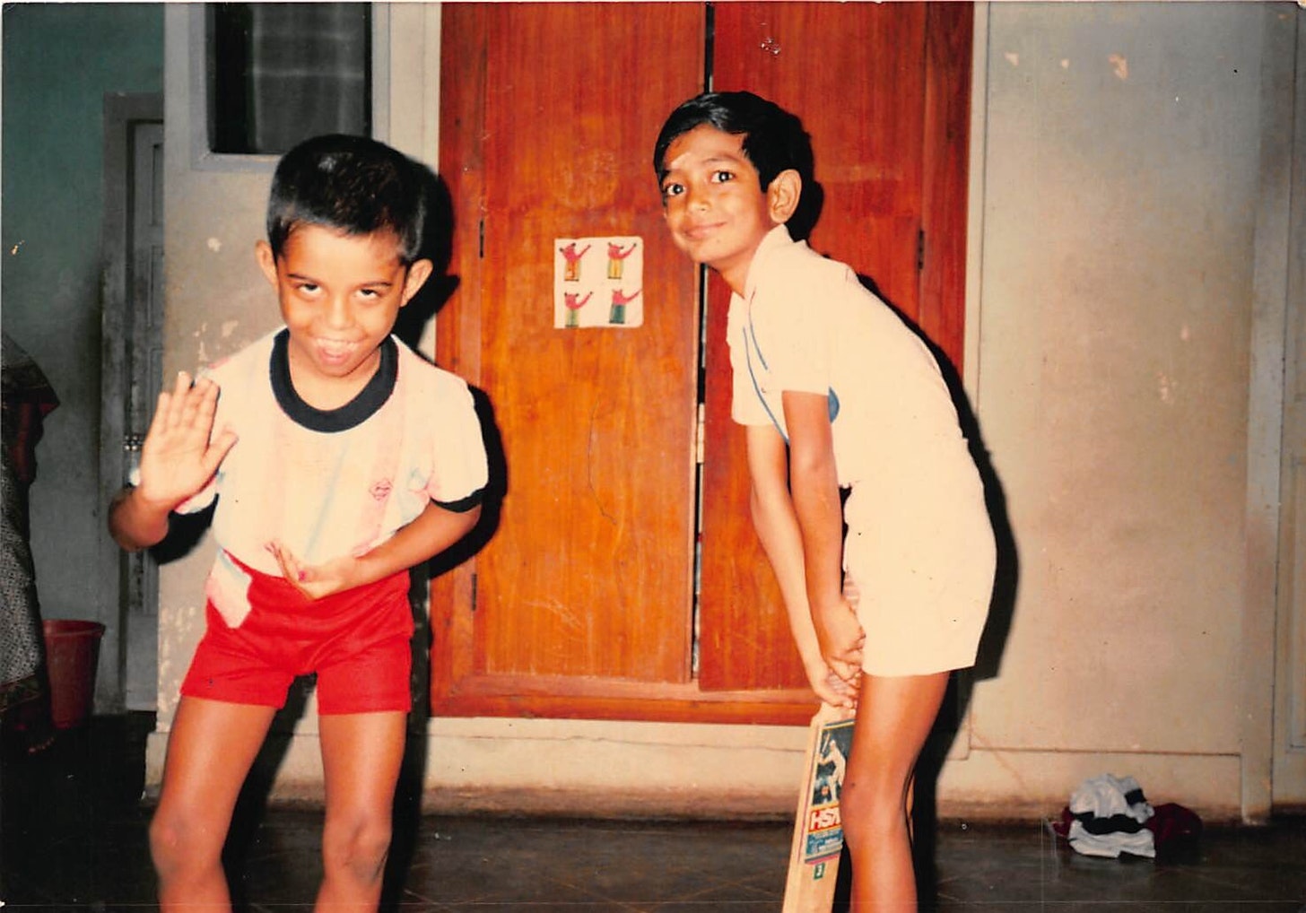 My cousin (Kichu) and I goofing around while waiting for the kozhakattais to get done!