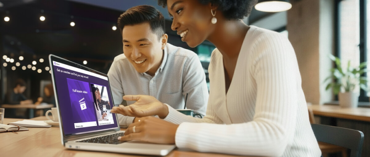Two people viewing an EventsAir eLearning module made from the HowToo platform on a laptop.