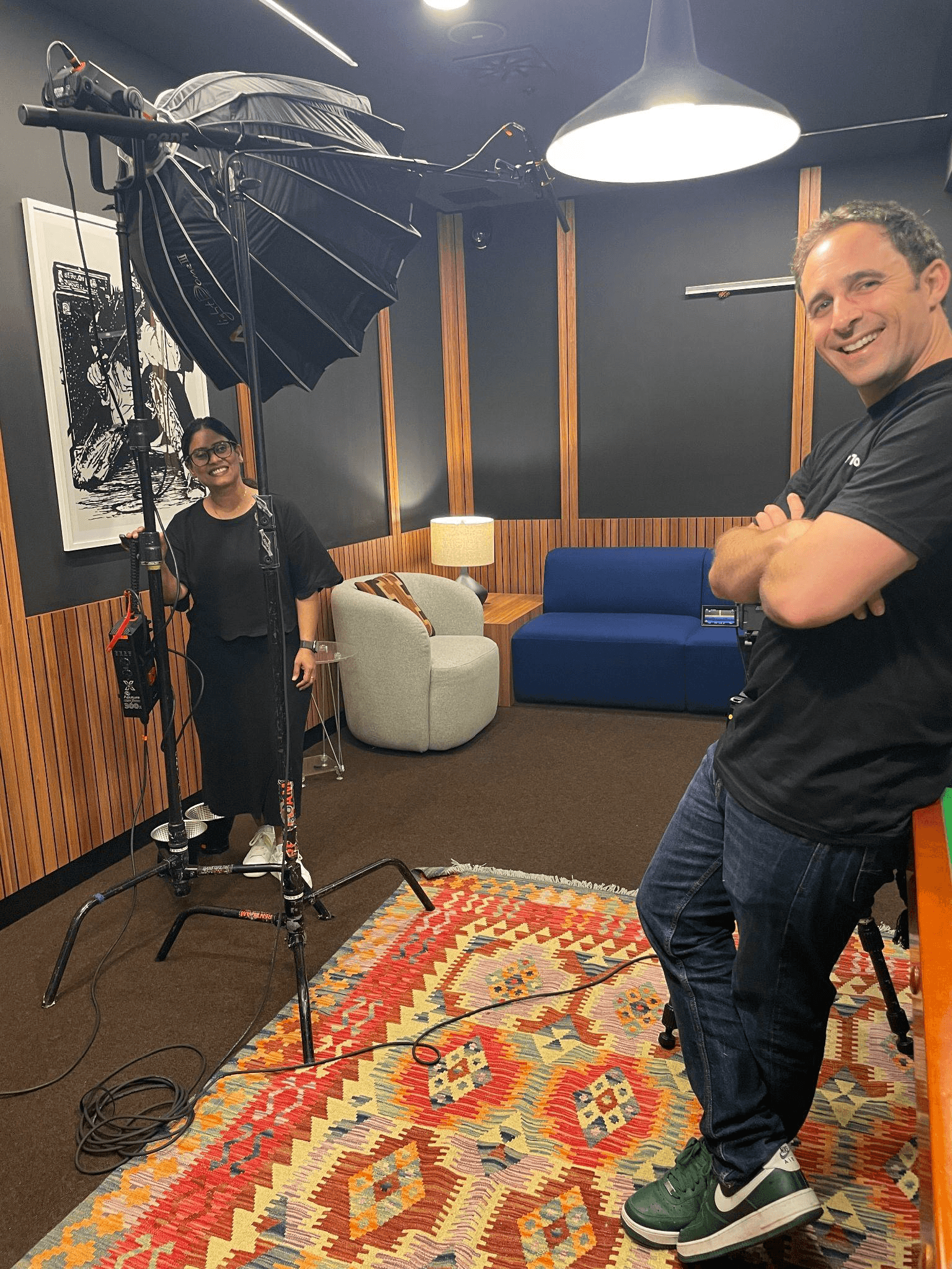 Behind the scenes of a customer video shoot, HowToo team members prepare for recording—highlighting the human element in customer education alongside the rise of AI-generated content.