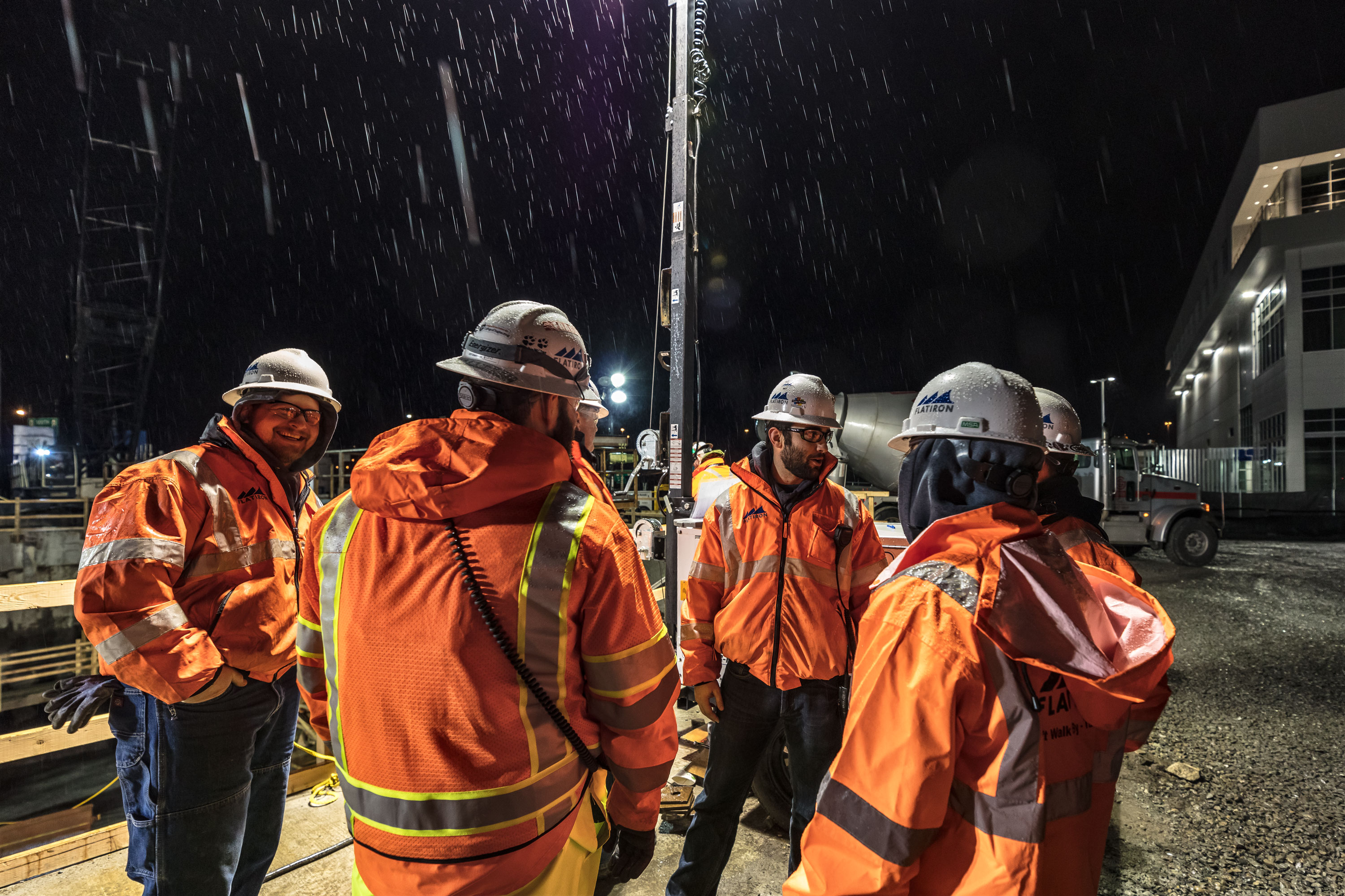 Nightime concrete pour, stormwater treatment facility, rainstorm, Seattle, Washington