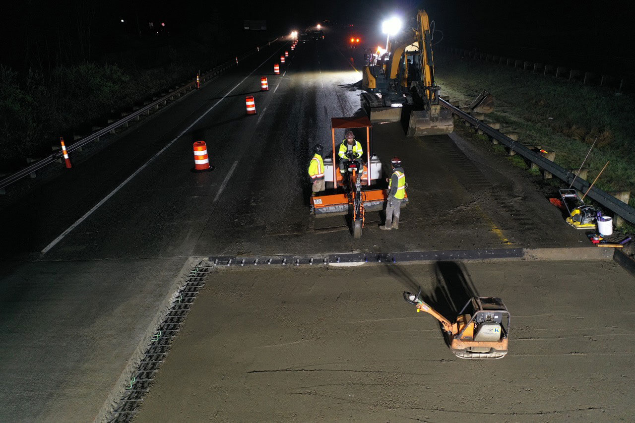 A nighttime aerial photo of a freeway construction project