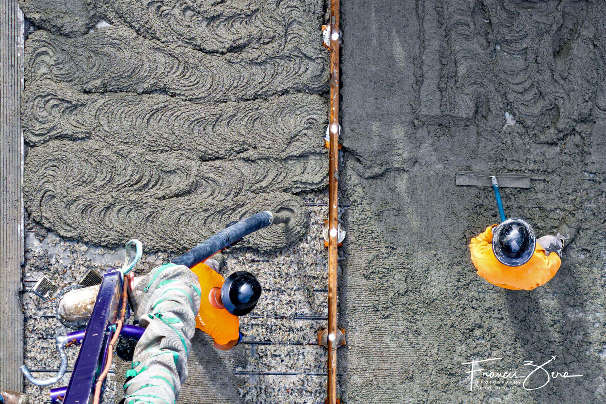 An aerial photo of workers pouring concrete