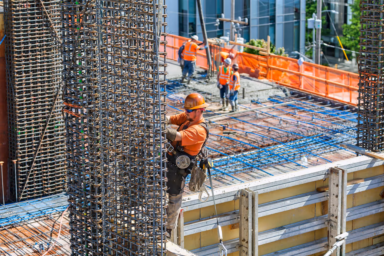 A construction worker working on a high-rise building project