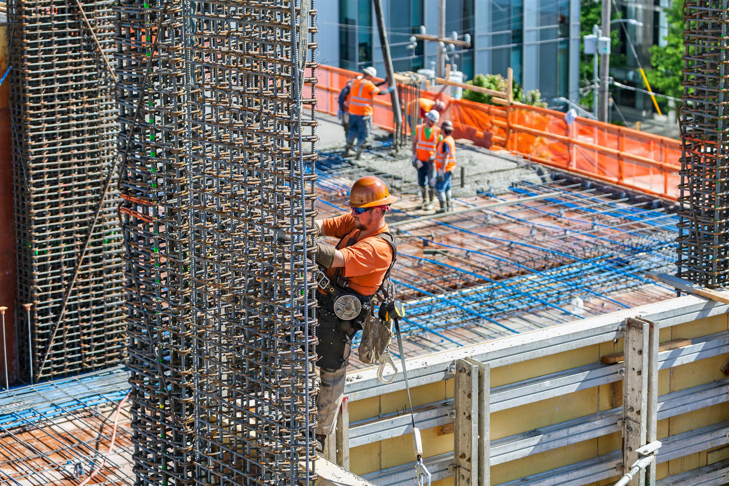A construction worker working on a high-rise building project