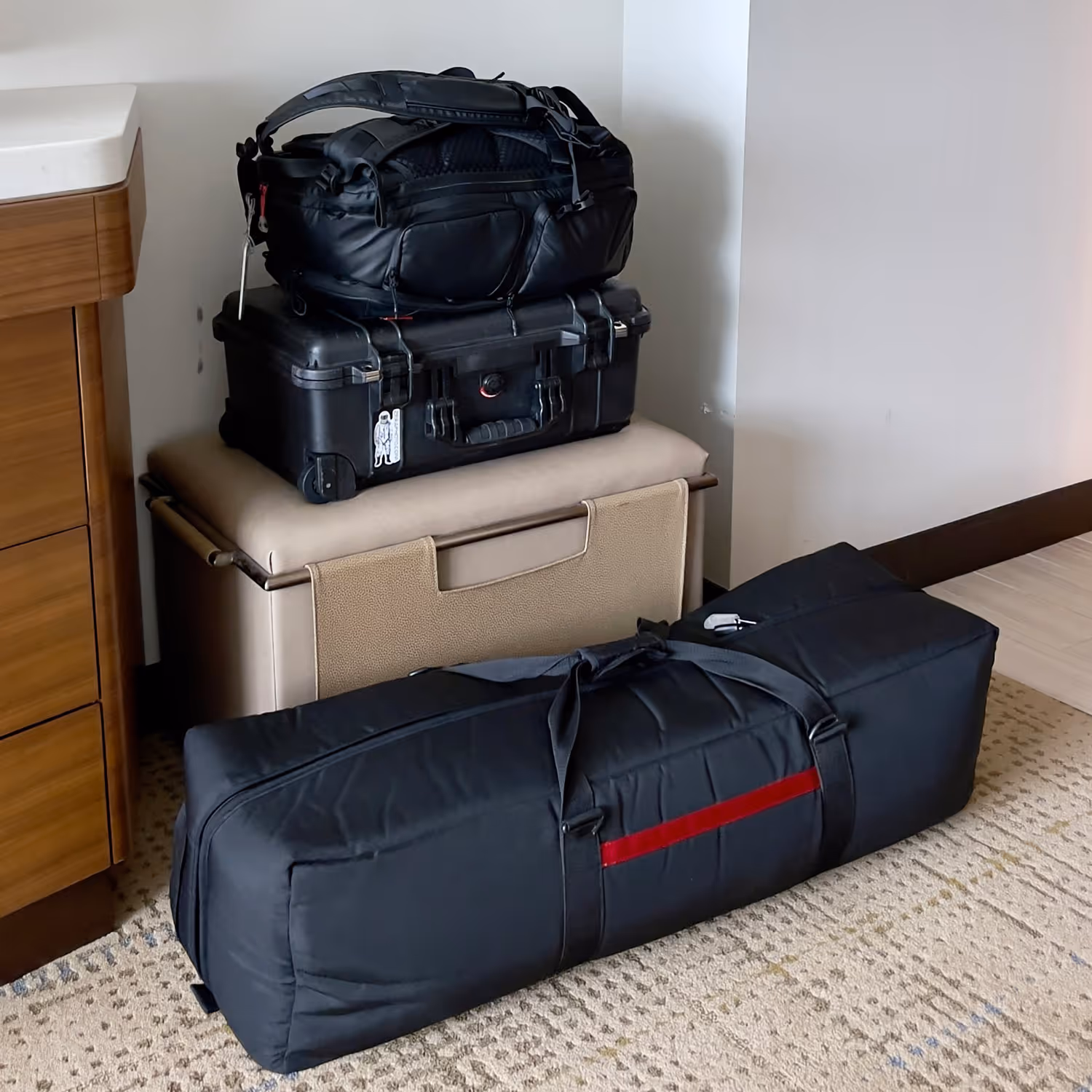 A photographer's luggage in a hotel room