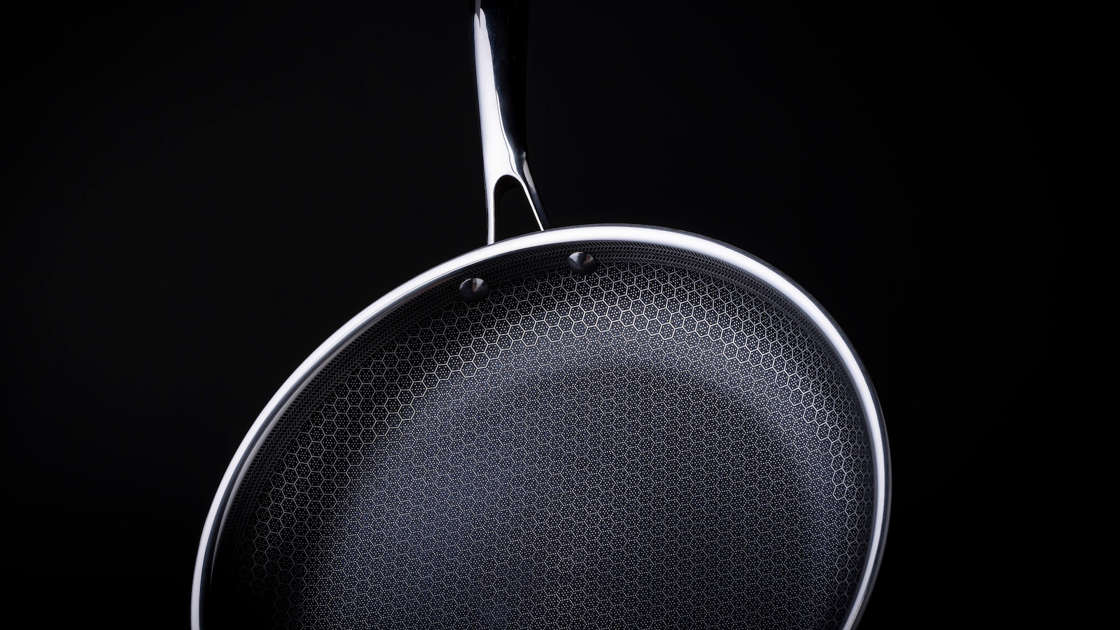 Sleek non-stick frying pan with hexagonal pattern and white trim