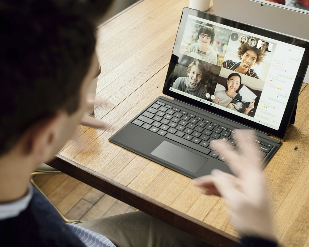 Photo of people having a virtual video meeting