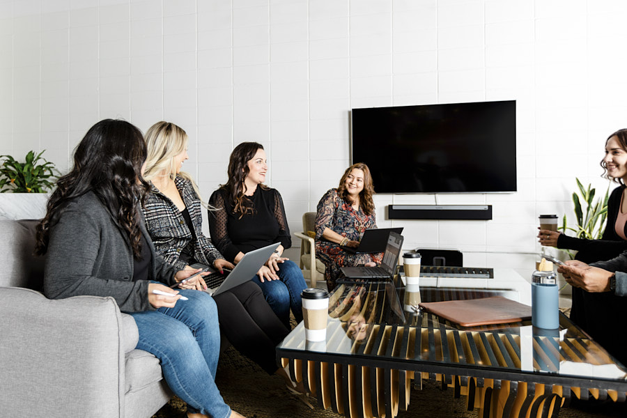 Coworkers talking around a table