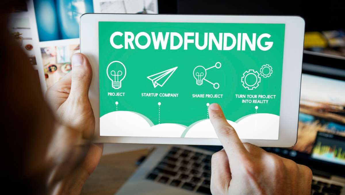 Man searching online for how to invest in real estate crowdfunding