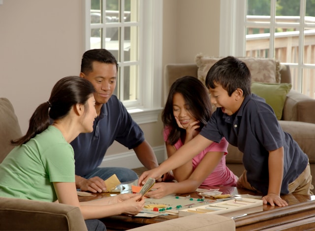 Family playing monopoly to practice real estate