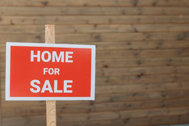 Home for sale sign for housing market cycle