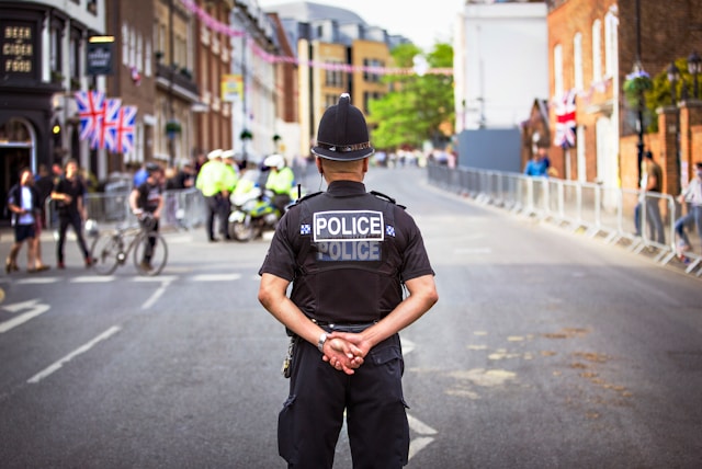 Policeman standing at the center of the road