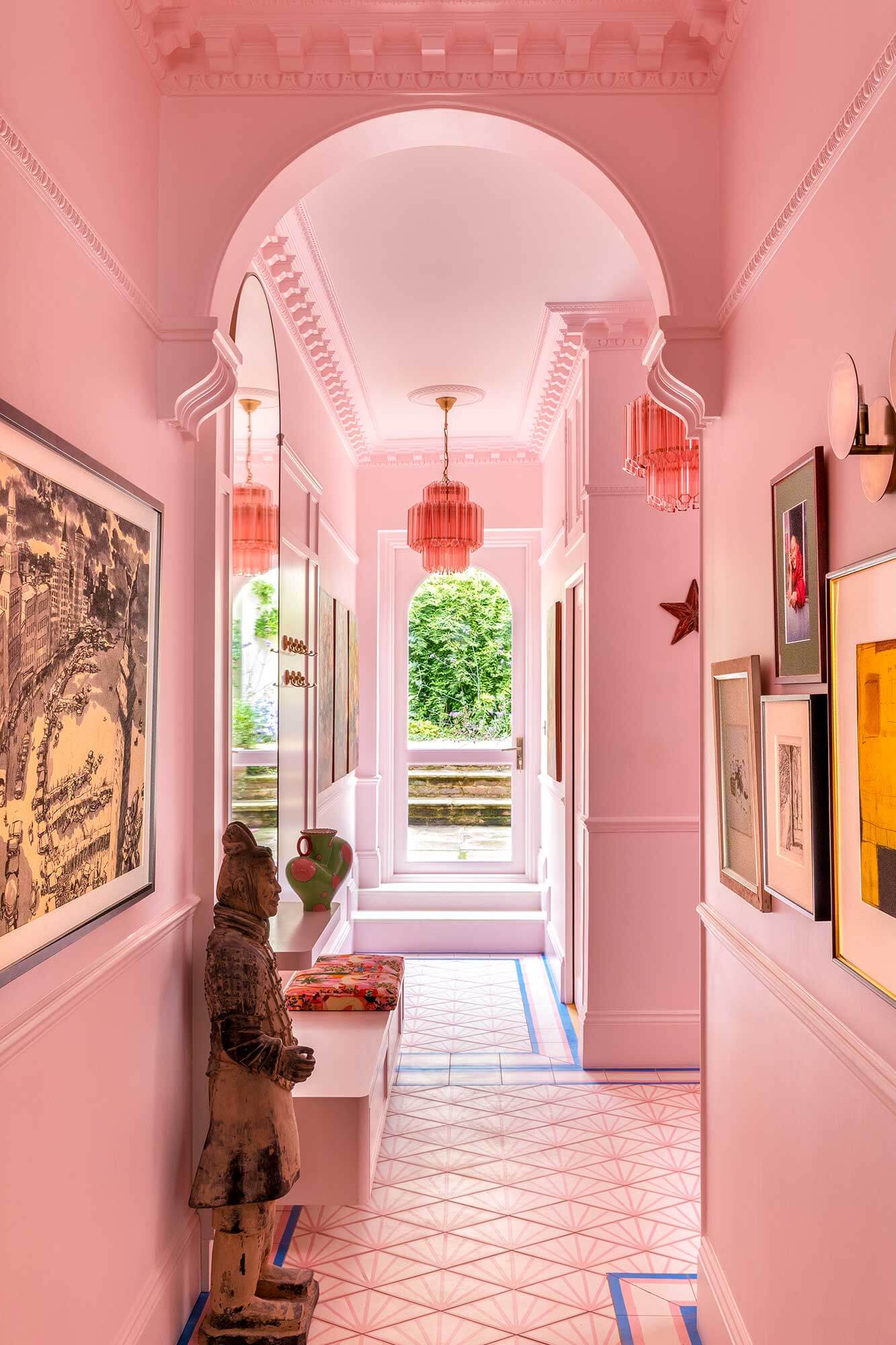 Eclectic pink hallway with original architectural features