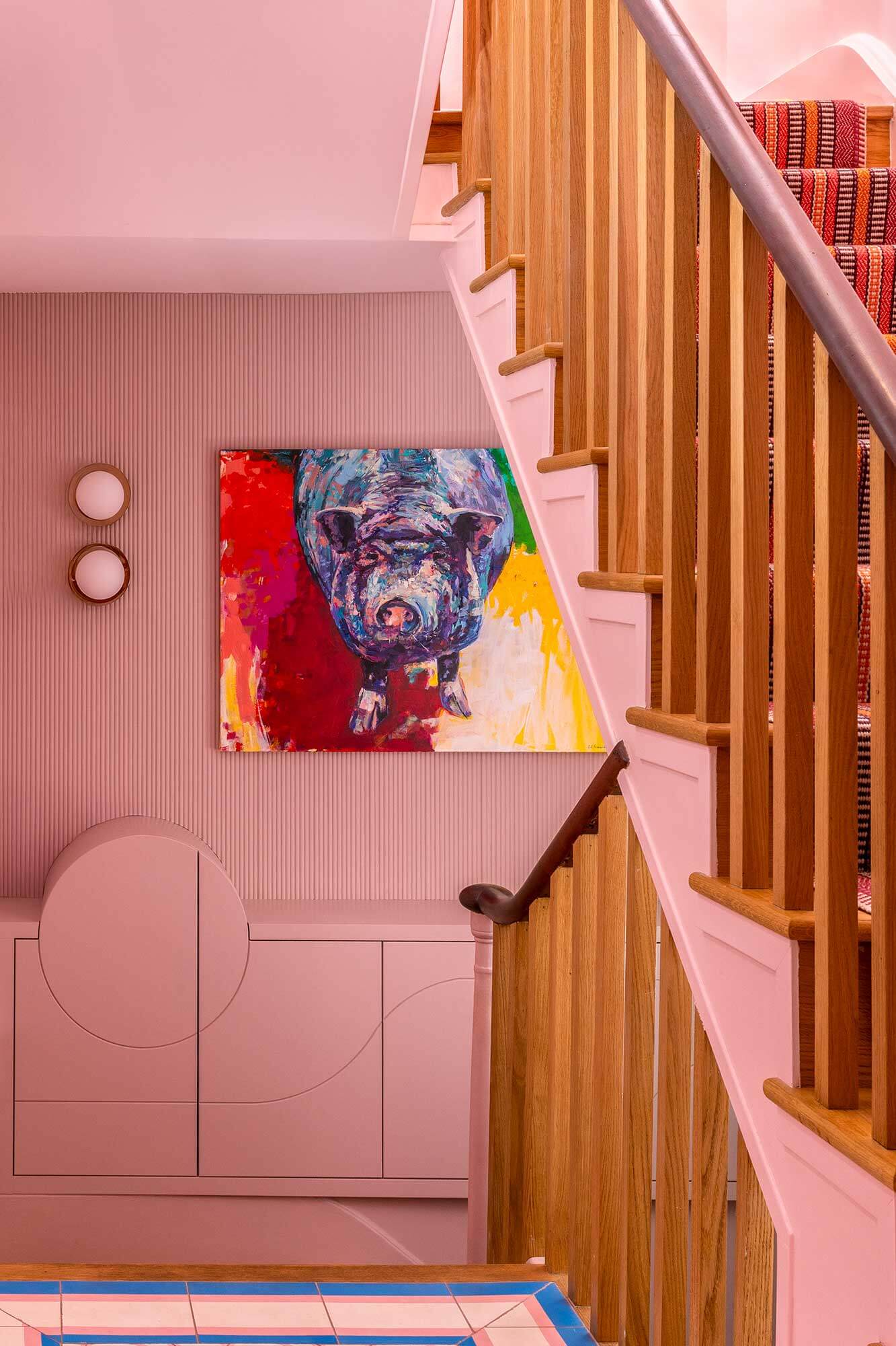 Pink staircase with bespoke hidden storage
