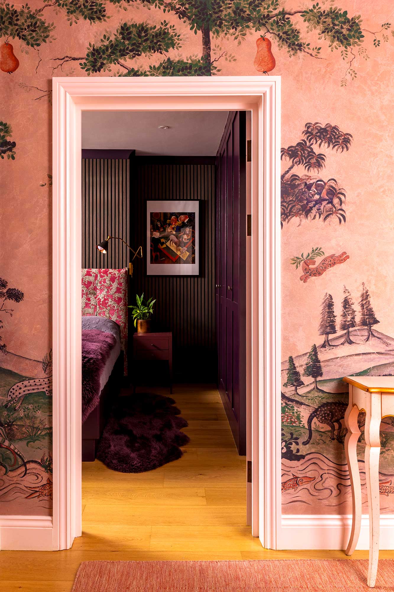dark wood panelling and plum-toned joinery create a rich, cocooning feel