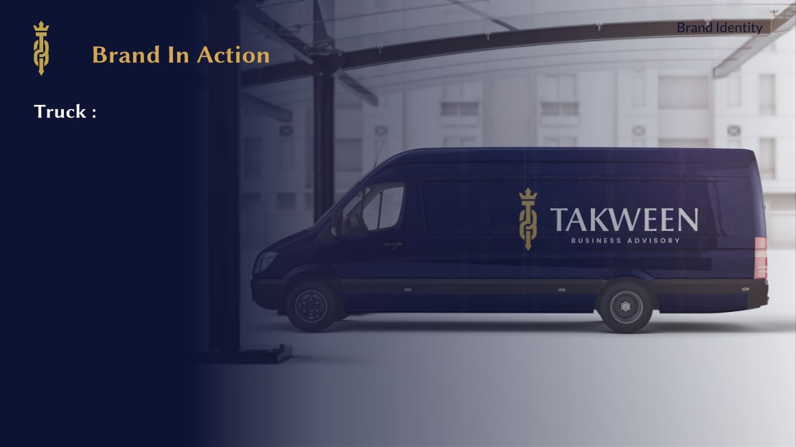 Dark blue cargo van inside a building with TAKWEEN Business Advisory logo and gold emblem on its side.