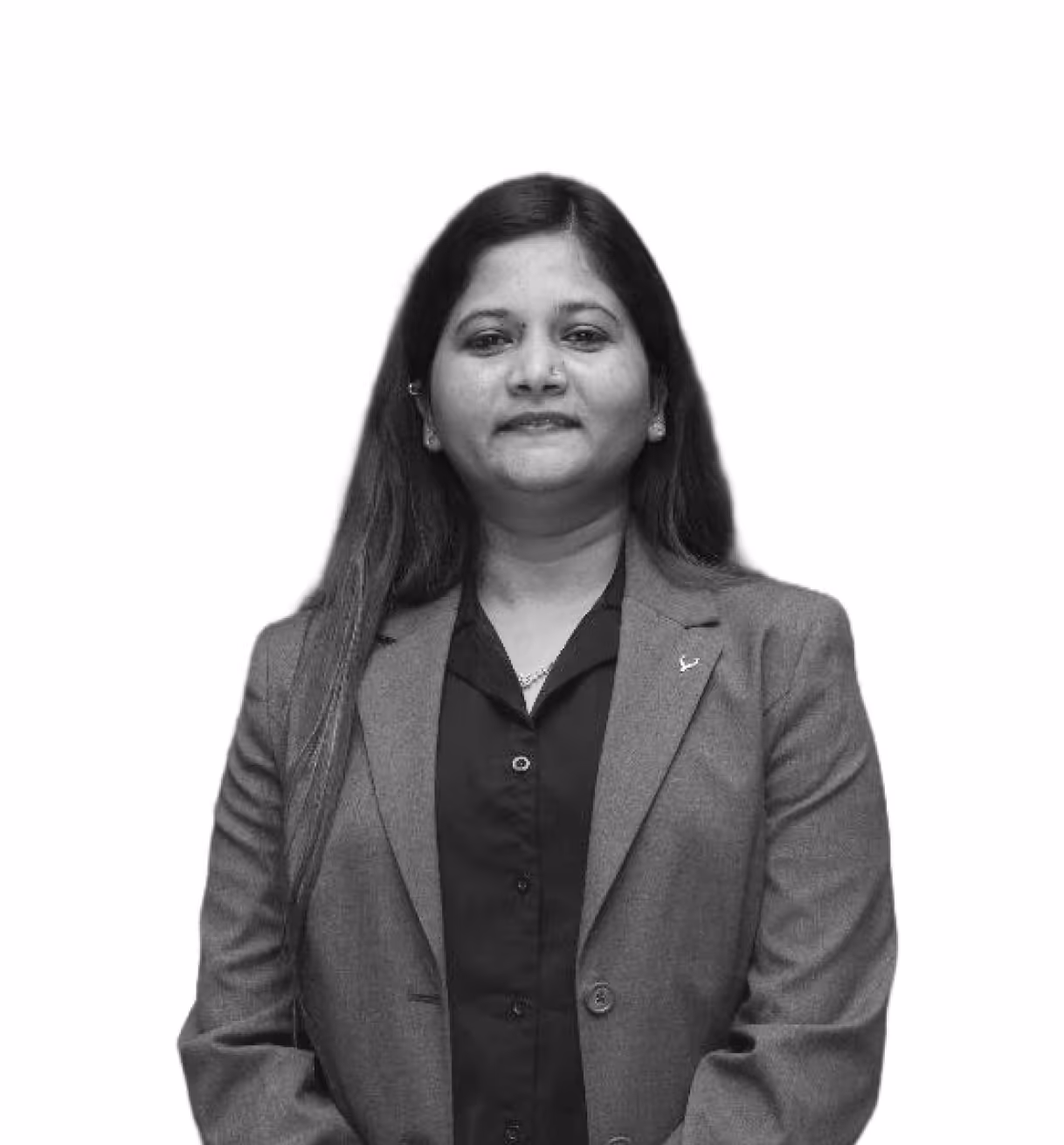 Portrait of a woman with long hair wearing a blazer and a buttoned shirt, standing against a white background.
