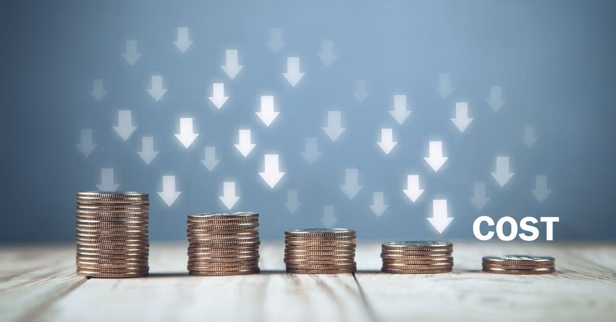 Stacks of coins decreasing in height from left to right with downward arrows above and the word 'COST' next to the smallest stack, symbolizing cost reduction.