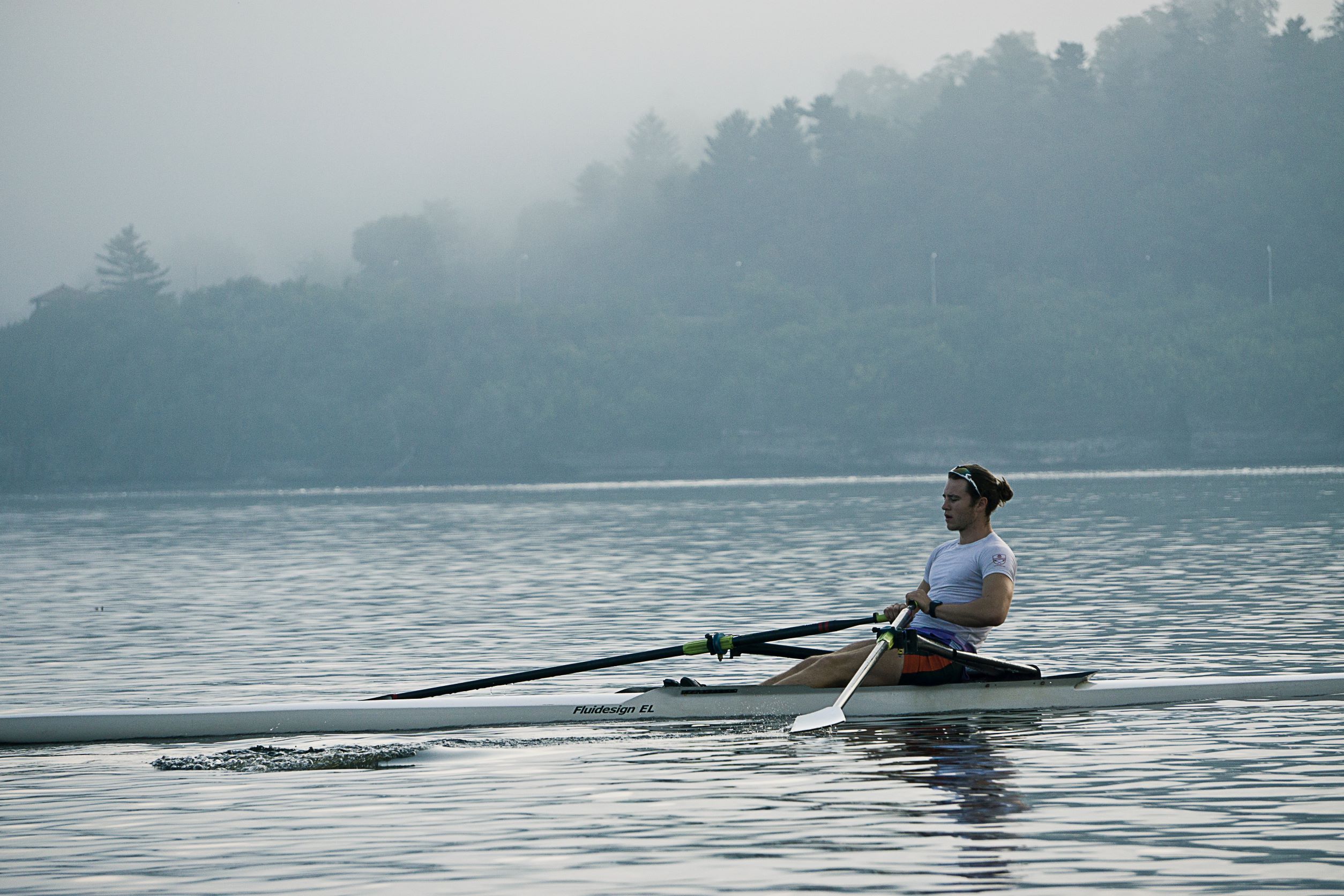 Picture of a person rowing in a lake