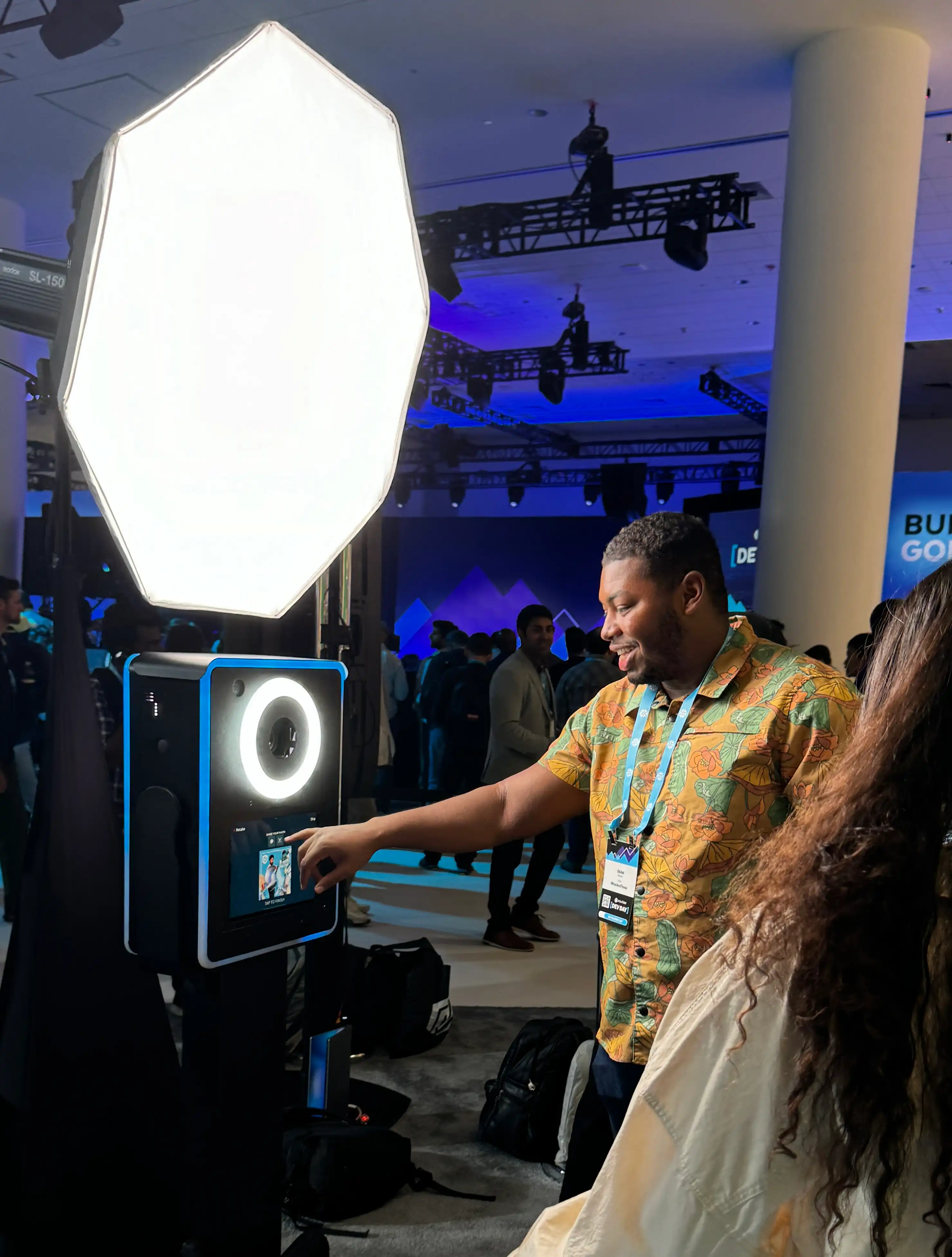 Guest stepping into frame at the AI video booth for a short branded clip