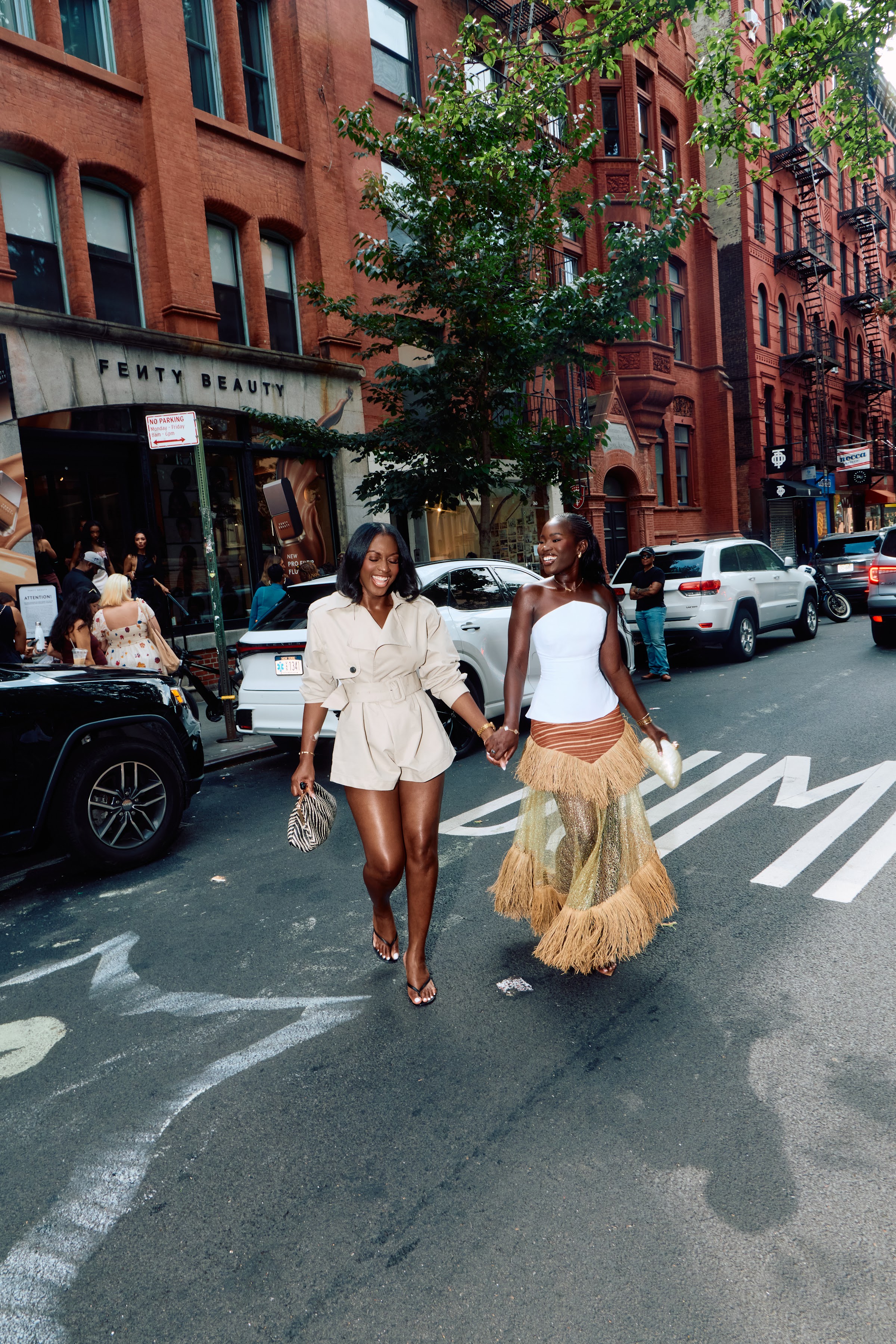Guests walking Mott Street outside the Fenty Beauty brand pop-up during New York Fashion Week NYC