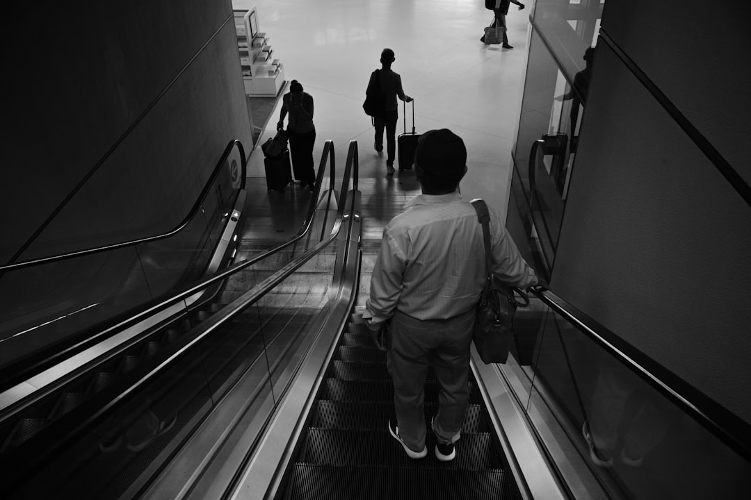 People on escalators in a modern building