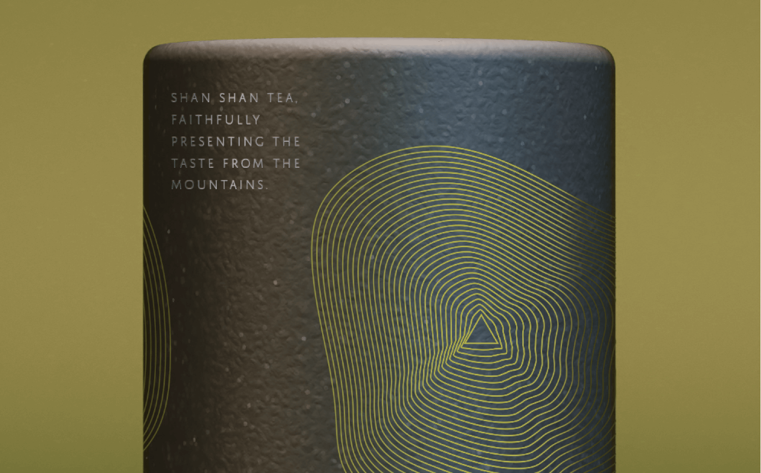 Close-up of a textured black tea container with yellow concentric line design and text about Shan Shan Tea.