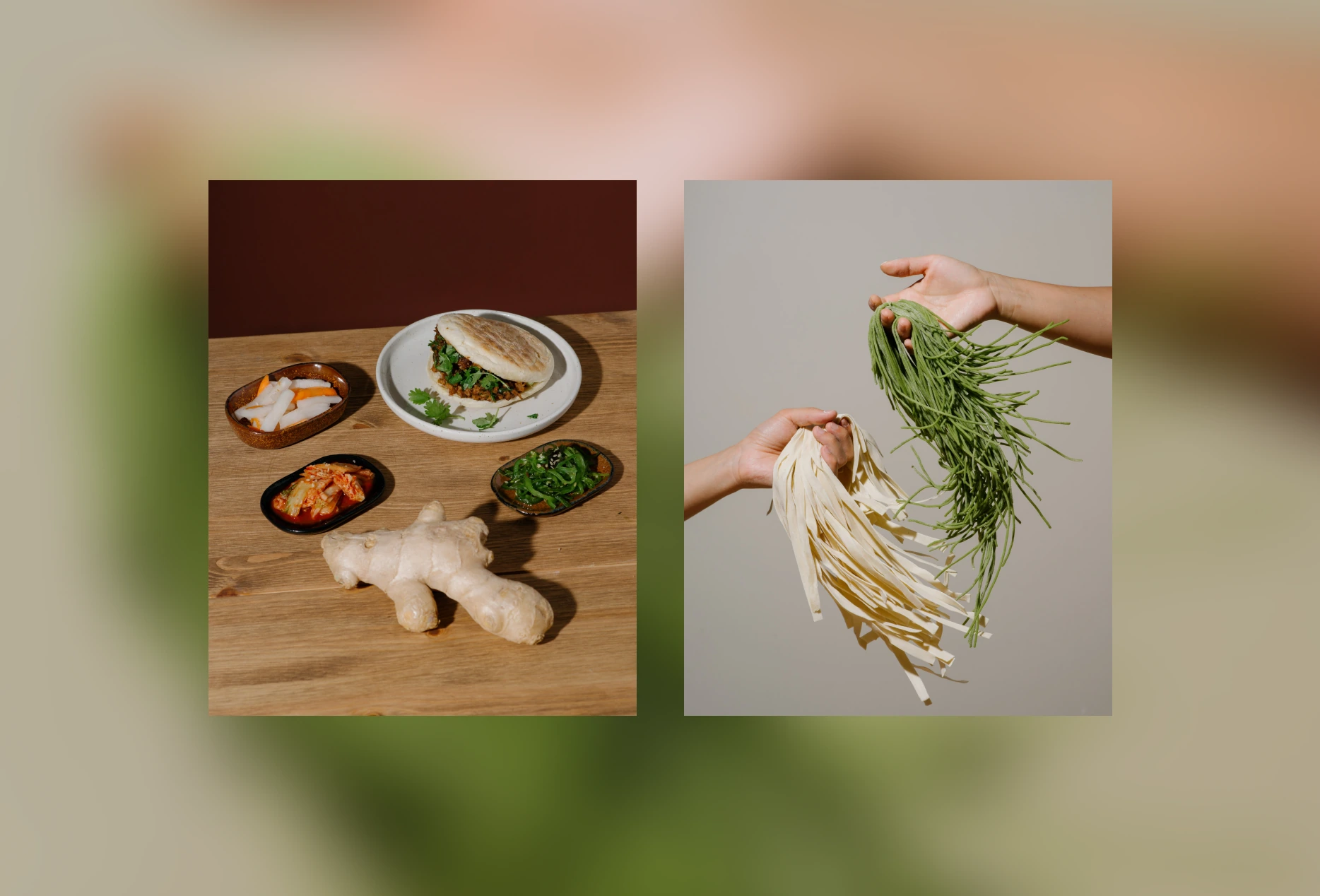 Two hands hold fresh green noodles and white flat noodles, next to ginger and condiment dishes on wood table.