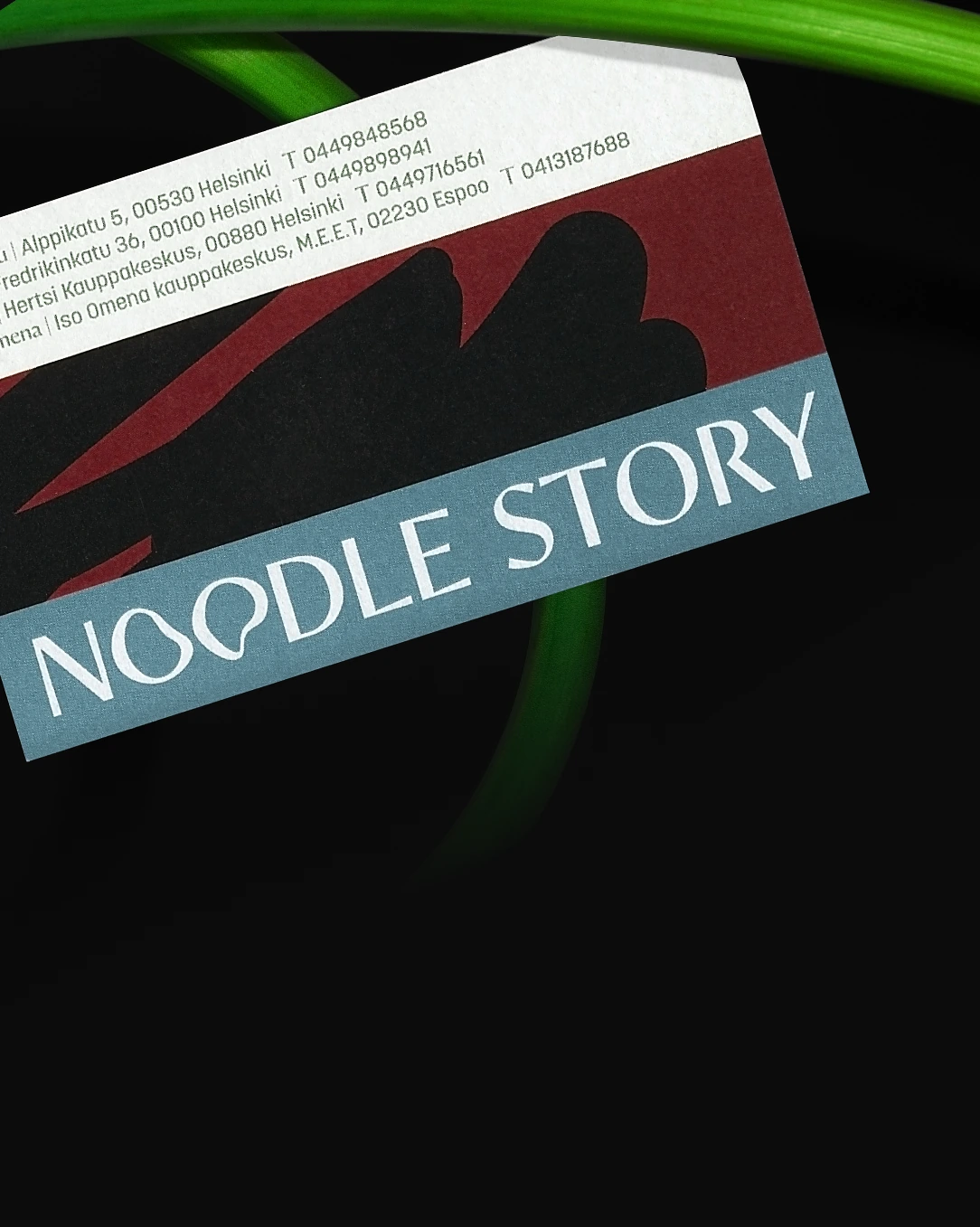 Business card for Noodle Story with contact details and an abstract logo on a dark background.