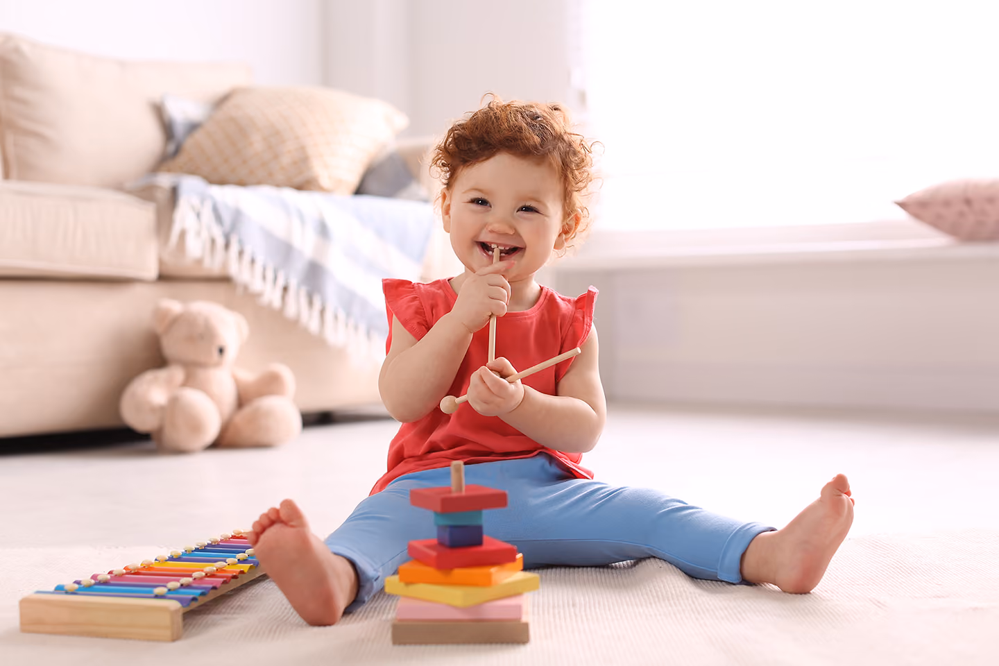 Child playing with toys on the floor