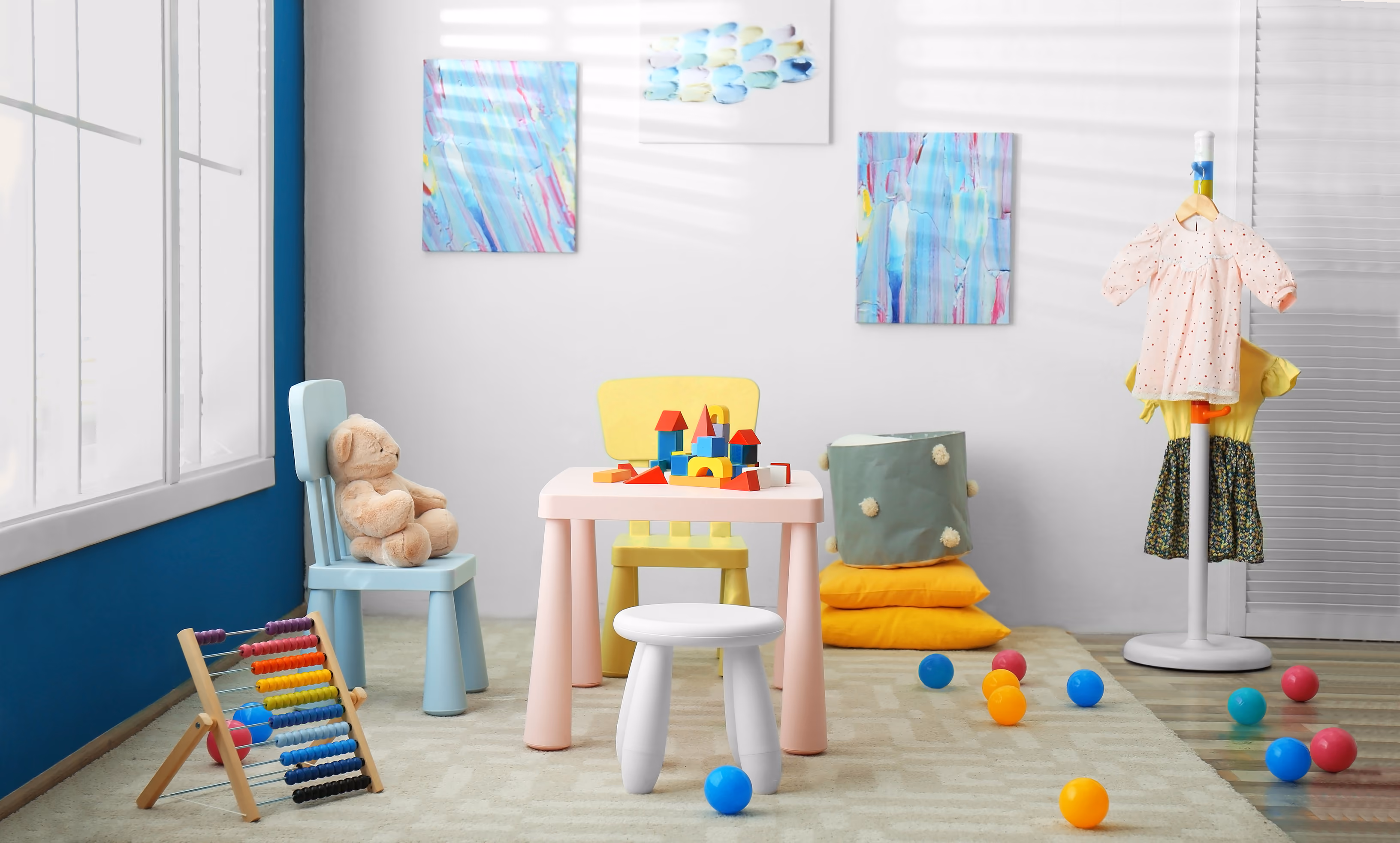 room in a campus with a table and toys