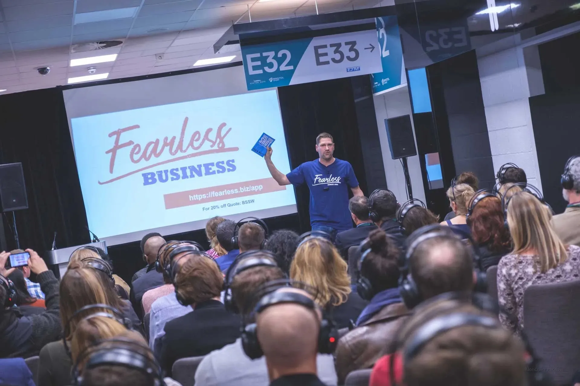 Robin Waite speaking on stage to a full room at the Bristol Business Showcase