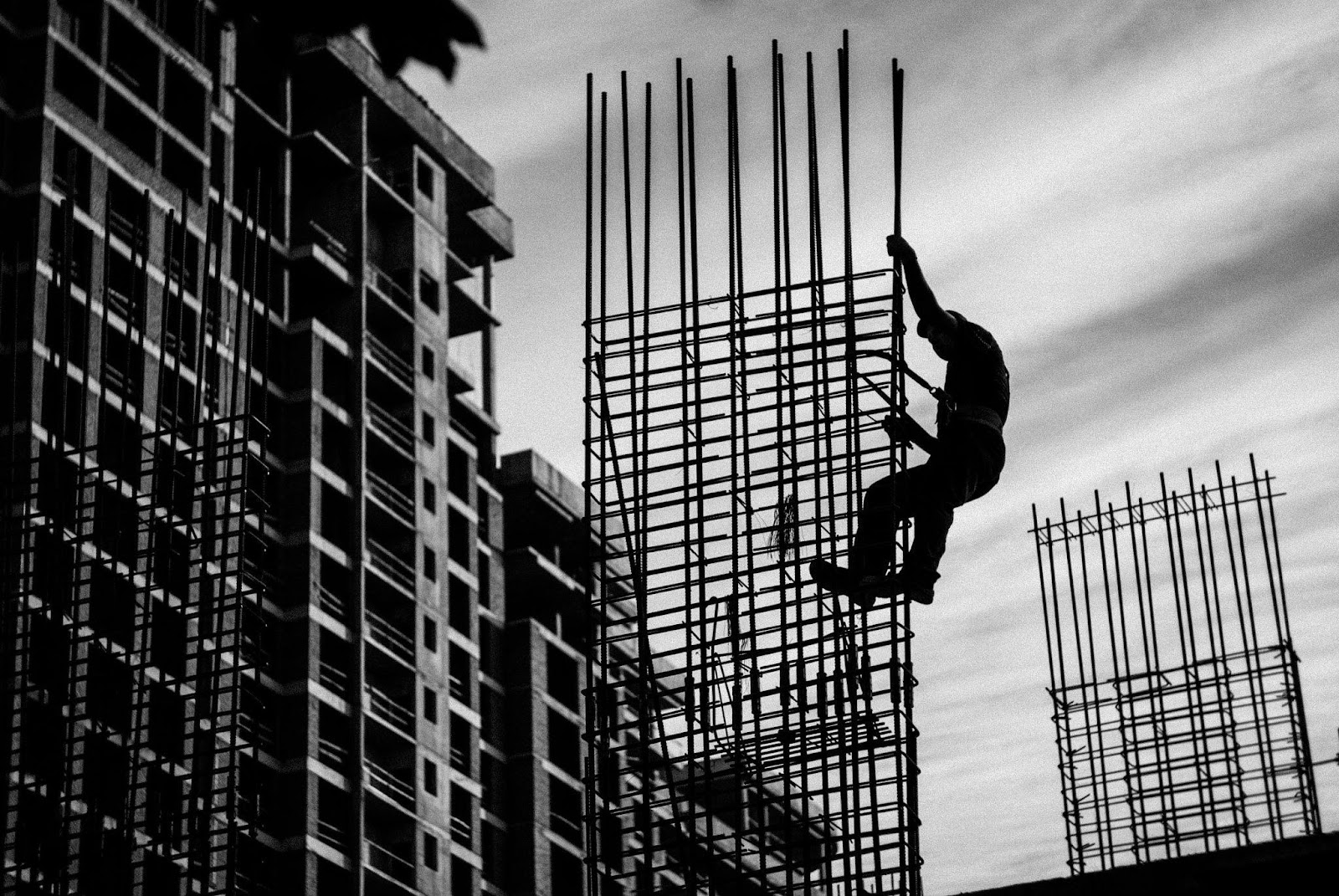 A construction worker in a hazardous position