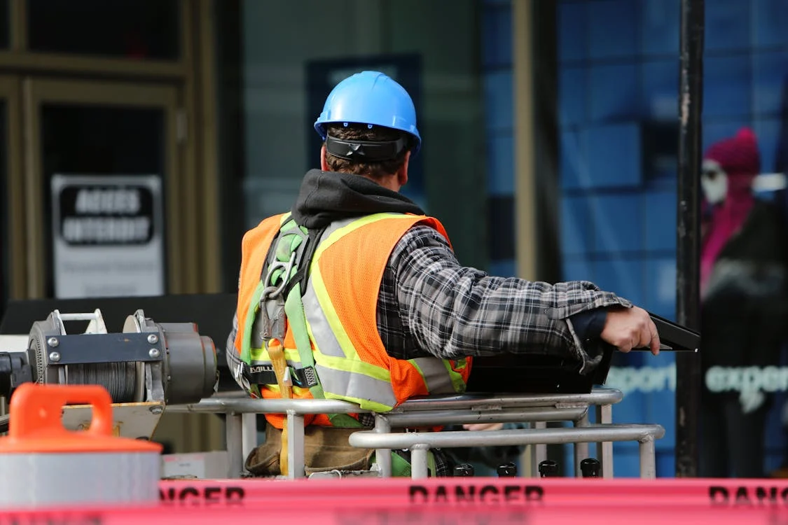 a worker wearing proper equipment for workplace safety.