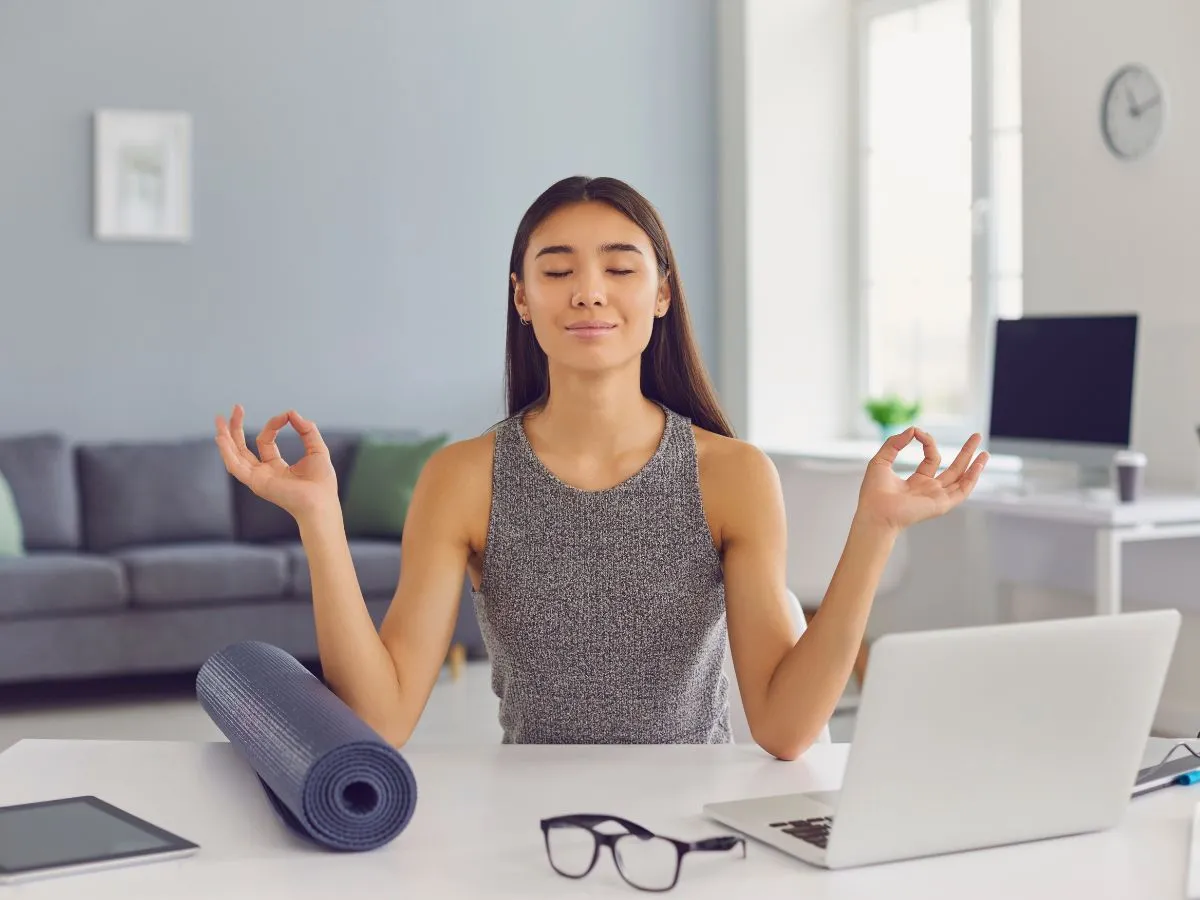 a businesswoman doing meditation  to improve mental health