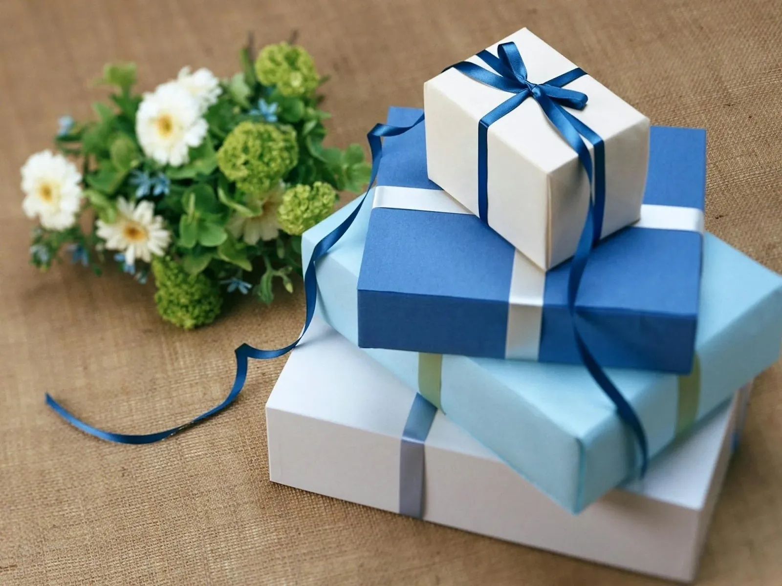 a stack of beautifully wrapped gifts