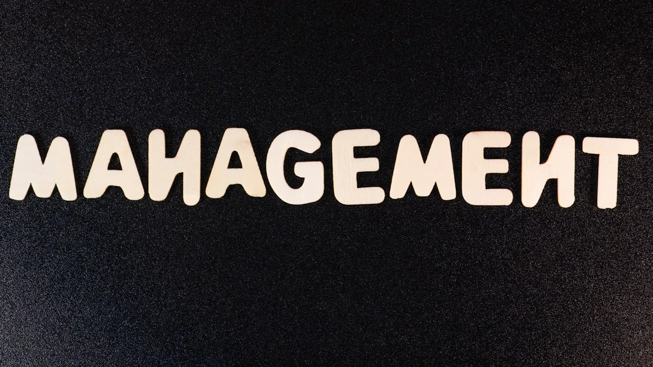 Management letters on a black background