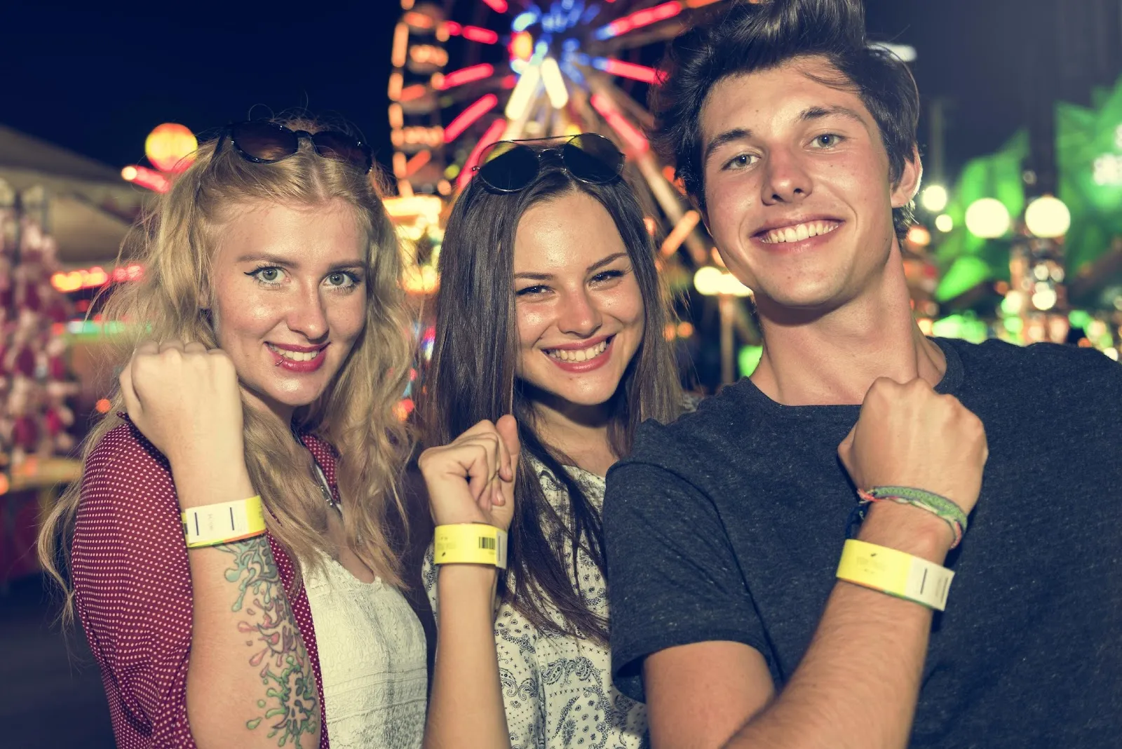 Young people with event wristbands